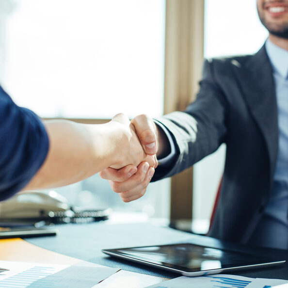 Close up of business handshake in the office